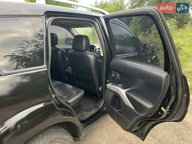 Чорний Міцубісі Аутлендер, об'ємом двигуна 3 л та пробігом 260 тис. км за 10700 $, фото 6 на Automoto.ua