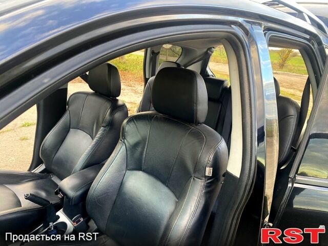 Черный Мицубиси Аутлендер, объемом двигателя 2 л и пробегом 207 тыс. км за 8100 $, фото 12 на Automoto.ua