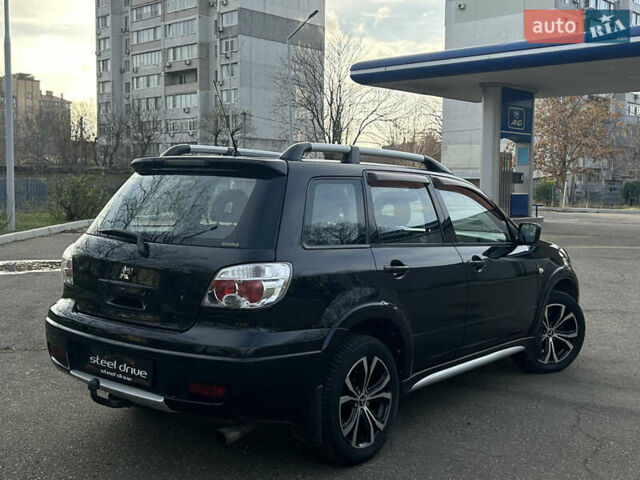 Черный Мицубиси Аутлендер, объемом двигателя 2.4 л и пробегом 320 тыс. км за 5999 $, фото 4 на Automoto.ua