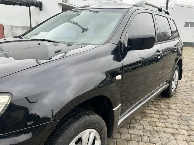 Чорний Міцубісі Аутлендер, об'ємом двигуна 2 л та пробігом 220 тис. км за 6299 $, фото 10 на Automoto.ua