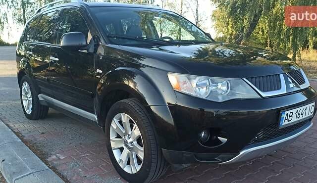Черный Мицубиси Аутлендер, объемом двигателя 1.97 л и пробегом 244 тыс. км за 9000 $, фото 6 на Automoto.ua