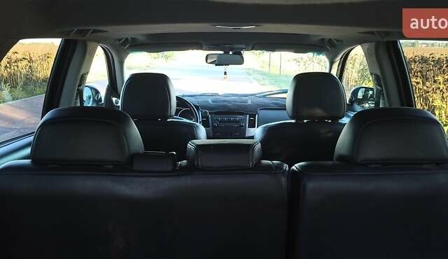 Черный Мицубиси Аутлендер, объемом двигателя 1.97 л и пробегом 244 тыс. км за 9000 $, фото 23 на Automoto.ua