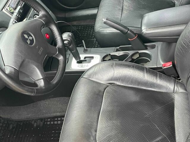 Черный Мицубиси Аутлендер, объемом двигателя 2.4 л и пробегом 213 тыс. км за 6850 $, фото 14 на Automoto.ua