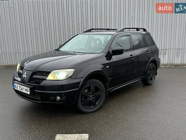 Чорний Міцубісі Аутлендер, об'ємом двигуна 2.38 л та пробігом 175 тис. км за 6000 $, фото 1 на Automoto.ua
