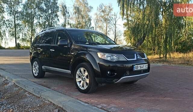 Черный Мицубиси Аутлендер, объемом двигателя 1.97 л и пробегом 244 тыс. км за 9000 $, фото 1 на Automoto.ua