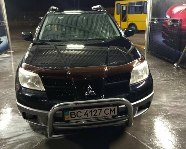 Черный Мицубиси Аутлендер, объемом двигателя 2 л и пробегом 295 тыс. км за 5300 $, фото 2 на Automoto.ua