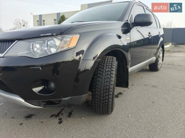 Черный Мицубиси Аутлендер, объемом двигателя 3 л и пробегом 155 тыс. км за 9800 $, фото 4 на Automoto.ua