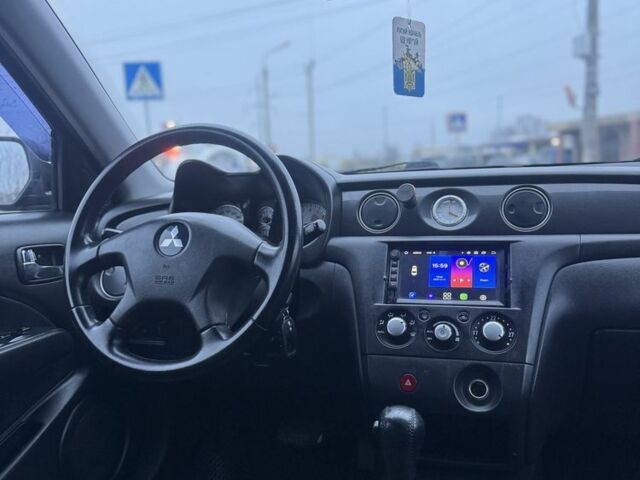 Чорний Міцубісі Аутлендер, об'ємом двигуна 2.4 л та пробігом 202 тис. км за 5800 $, фото 17 на Automoto.ua