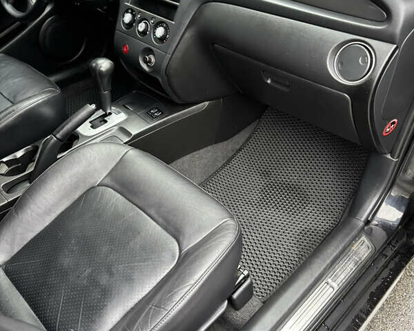 Чорний Міцубісі Аутлендер, об'ємом двигуна 2.4 л та пробігом 169 тис. км за 8000 $, фото 7 на Automoto.ua