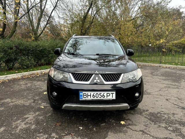 Черный Мицубиси Аутлендер, объемом двигателя 2.4 л и пробегом 230 тыс. км за 8500 $, фото 1 на Automoto.ua