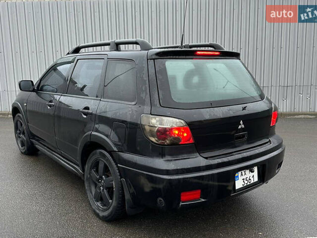 Чорний Міцубісі Аутлендер, об'ємом двигуна 2.38 л та пробігом 175 тис. км за 6000 $, фото 3 на Automoto.ua