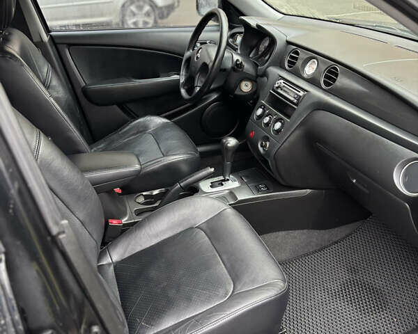 Чорний Міцубісі Аутлендер, об'ємом двигуна 2.4 л та пробігом 169 тис. км за 8000 $, фото 5 на Automoto.ua