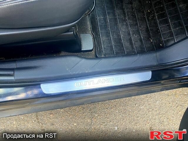Черный Мицубиси Аутлендер, объемом двигателя 2 л и пробегом 207 тыс. км за 8100 $, фото 4 на Automoto.ua