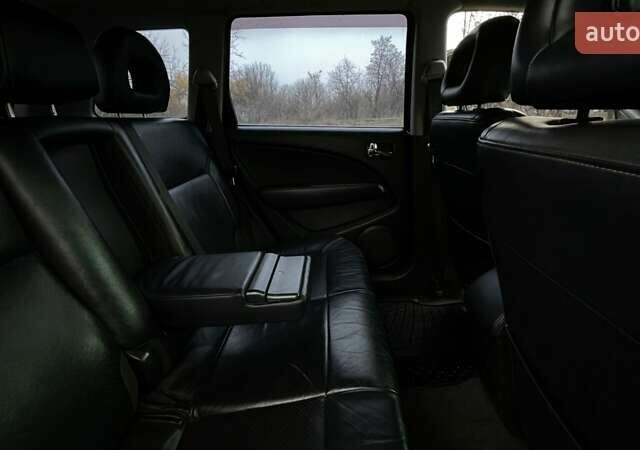 Черный Мицубиси Аутлендер, объемом двигателя 2.38 л и пробегом 215 тыс. км за 5800 $, фото 2 на Automoto.ua