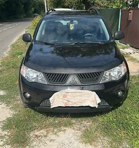 Черный Мицубиси Аутлендер, объемом двигателя 3 л и пробегом 257 тыс. км за 9200 $, фото 1 на Automoto.ua
