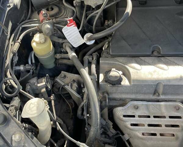 Черный Мицубиси Аутлендер, объемом двигателя 2.38 л и пробегом 310 тыс. км за 7500 $, фото 5 на Automoto.ua