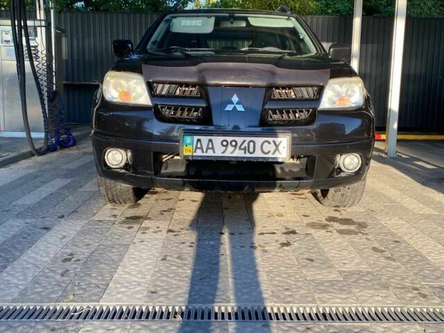 Черный Мицубиси Аутлендер, объемом двигателя 2.4 л и пробегом 219 тыс. км за 6500 $, фото 1 на Automoto.ua