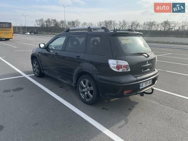 Черный Мицубиси Аутлендер, объемом двигателя 2.38 л и пробегом 180 тыс. км за 6900 $, фото 2 на Automoto.ua