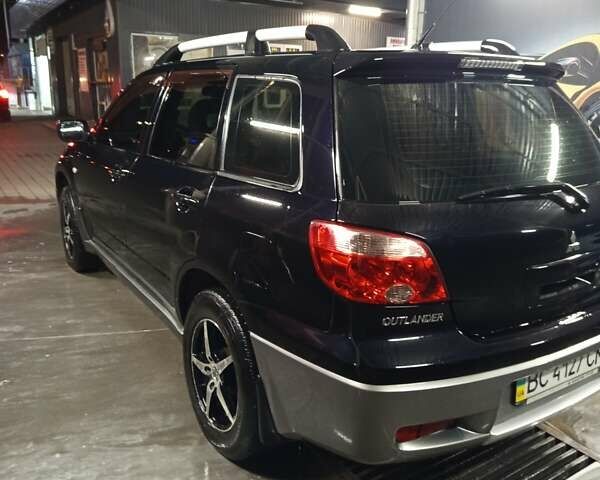 Черный Мицубиси Аутлендер, объемом двигателя 2 л и пробегом 295 тыс. км за 5300 $, фото 4 на Automoto.ua