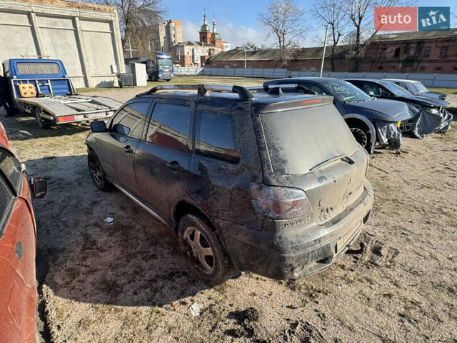 Черный Мицубиси Аутлендер, объемом двигателя 2 л и пробегом 258 тыс. км за 2200 $, фото 6 на Automoto.ua