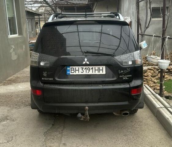 Черный Мицубиси Аутлендер, объемом двигателя 2.4 л и пробегом 240 тыс. км за 8500 $, фото 2 на Automoto.ua