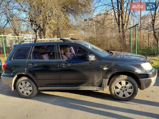 Чорний Міцубісі Аутлендер, об'ємом двигуна 2 л та пробігом 260 тис. км за 5500 $, фото 10 на Automoto.ua