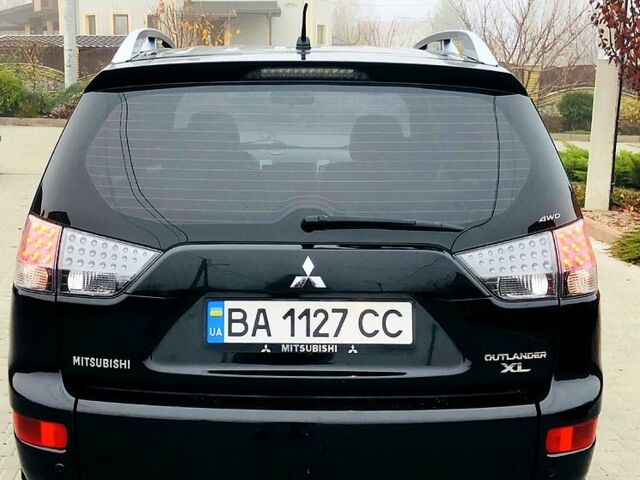 Черный Мицубиси Аутлендер, объемом двигателя 3 л и пробегом 230 тыс. км за 8999 $, фото 4 на Automoto.ua