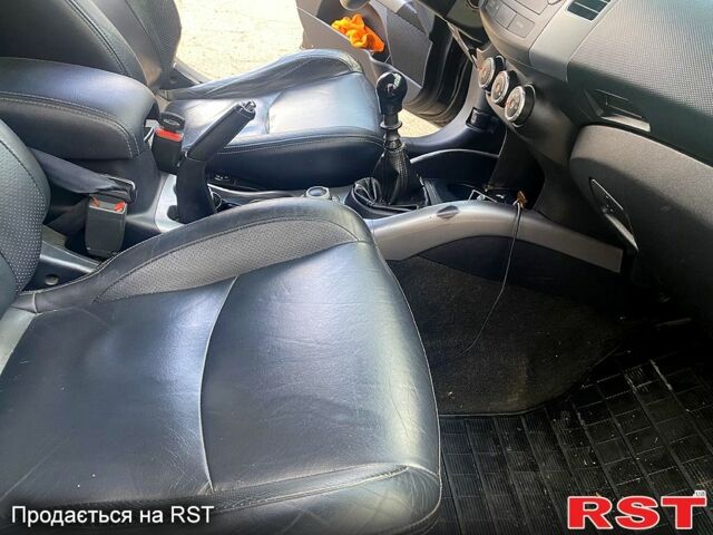 Черный Мицубиси Аутлендер, объемом двигателя 2 л и пробегом 207 тыс. км за 8100 $, фото 2 на Automoto.ua