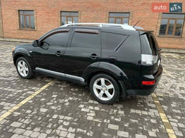 Черный Мицубиси Аутлендер, объемом двигателя 3 л и пробегом 200 тыс. км за 7999 $, фото 14 на Automoto.ua