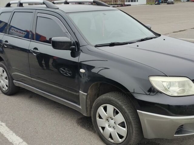 Чорний Міцубісі Аутлендер, об'ємом двигуна 2 л та пробігом 175 тис. км за 7800 $, фото 2 на Automoto.ua