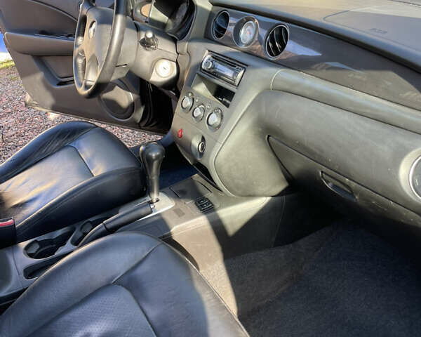 Черный Мицубиси Аутлендер, объемом двигателя 2.38 л и пробегом 118 тыс. км за 6850 $, фото 7 на Automoto.ua