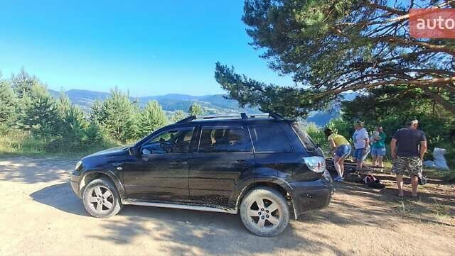 Черный Мицубиси Аутлендер, объемом двигателя 2.4 л и пробегом 270 тыс. км за 6900 $, фото 2 на Automoto.ua