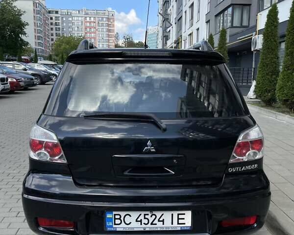 Черный Мицубиси Аутлендер, объемом двигателя 2.38 л и пробегом 310 тыс. км за 7500 $, фото 18 на Automoto.ua