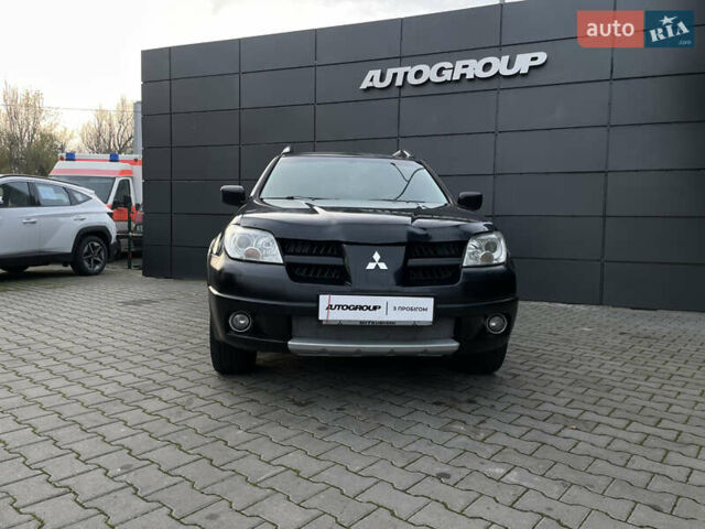 Черный Мицубиси Аутлендер, объемом двигателя 2.4 л и пробегом 248 тыс. км за 7300 $, фото 3 на Automoto.ua