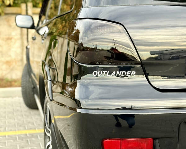 Міцубісі Аутлендер 2007 у Одесі на Automoto.ua Чорний Міцубісі Аутлендер, об'ємом двигуна 2.4 л та пробігом 201 тис. км за 7700 $, фото 12 на Automoto.ua