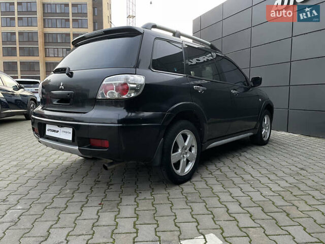 Черный Мицубиси Аутлендер, объемом двигателя 2.4 л и пробегом 248 тыс. км за 7300 $, фото 23 на Automoto.ua