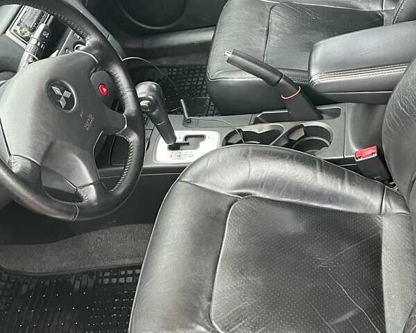 Чорний Міцубісі Аутлендер, об'ємом двигуна 2.4 л та пробігом 213 тис. км за 6850 $, фото 17 на Automoto.ua