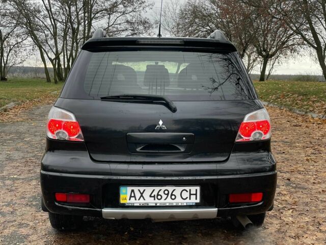 Черный Мицубиси Аутлендер, объемом двигателя 2.4 л и пробегом 213 тыс. км за 6850 $, фото 9 на Automoto.ua