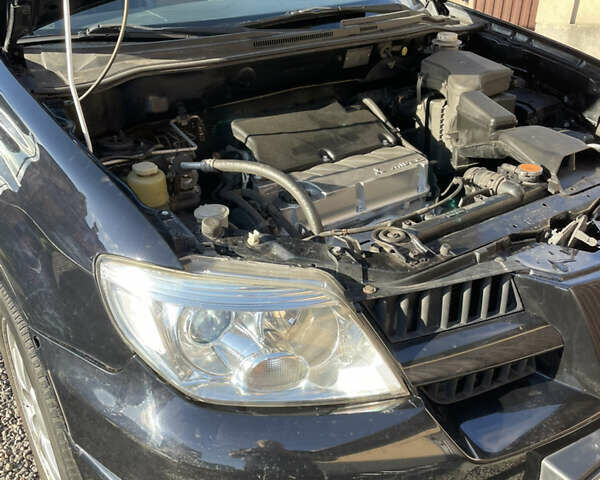 Черный Мицубиси Аутлендер, объемом двигателя 2.38 л и пробегом 118 тыс. км за 6850 $, фото 12 на Automoto.ua