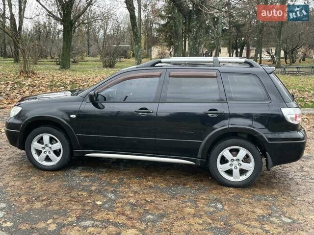 Чорний Міцубісі Аутлендер, об'ємом двигуна 2.4 л та пробігом 213 тис. км за 6850 $, фото 6 на Automoto.ua