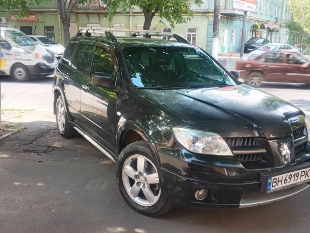 Черный Мицубиси Аутлендер, объемом двигателя 2.4 л и пробегом 248 тыс. км за 7000 $, фото 2 на Automoto.ua