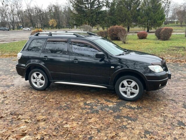 Черный Мицубиси Аутлендер, объемом двигателя 2.4 л и пробегом 213 тыс. км за 6850 $, фото 5 на Automoto.ua