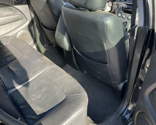 Черный Мицубиси Аутлендер, объемом двигателя 2.38 л и пробегом 118 тыс. км за 6850 $, фото 8 на Automoto.ua