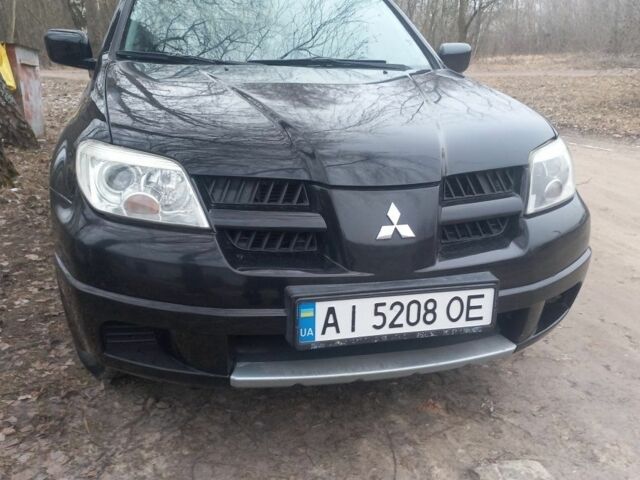 Чорний Міцубісі Аутлендер, об'ємом двигуна 2 л та пробігом 245 тис. км за 5400 $, фото 10 на Automoto.ua