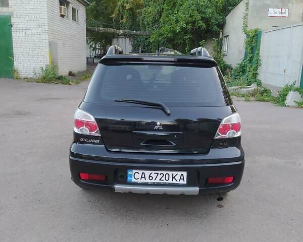 Чорний Міцубісі Аутлендер, об'ємом двигуна 2 л та пробігом 185 тис. км за 7300 $, фото 4 на Automoto.ua