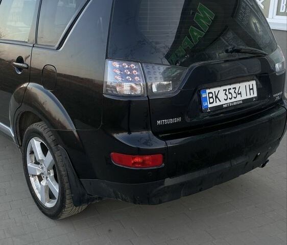 Чорний Міцубісі Аутлендер, об'ємом двигуна 2.4 л та пробігом 200 тис. км за 8300 $, фото 3 на Automoto.ua