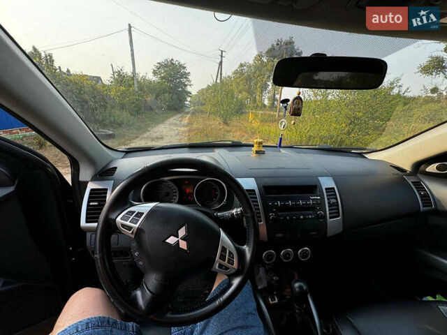 Черный Мицубиси Аутлендер, объемом двигателя 2 л и пробегом 200 тыс. км за 7700 $, фото 6 на Automoto.ua