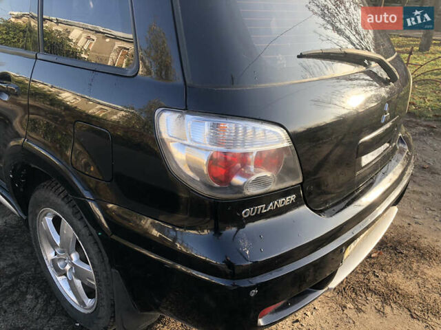 Черный Мицубиси Аутлендер, объемом двигателя 2.4 л и пробегом 260 тыс. км за 7200 $, фото 12 на Automoto.ua