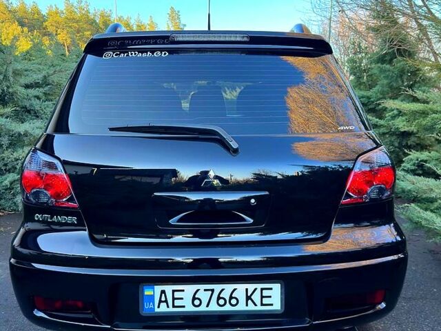 Чорний Міцубісі Аутлендер, об'ємом двигуна 2 л та пробігом 167 тис. км за 8600 $, фото 6 на Automoto.ua