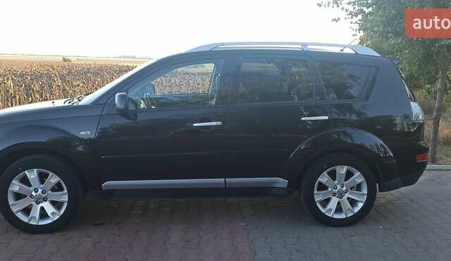 Черный Мицубиси Аутлендер, объемом двигателя 1.97 л и пробегом 244 тыс. км за 9000 $, фото 9 на Automoto.ua